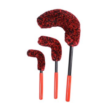 Three red-and-black fuzzy dusters on orange handles, varying in size, arranged upright for cleaning tasks of delicate surfaces.